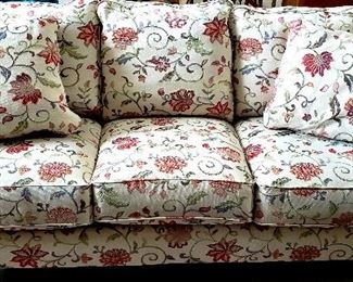 Comfy floral sofa with two extra pillows