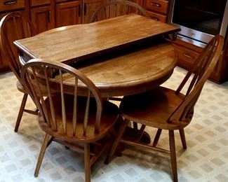 Round pedestal all wood table, leaf with skirt & four solid chairs