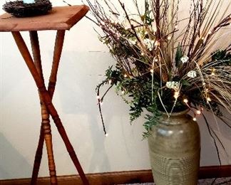 Three legged table & crockery vase with lighted twigs