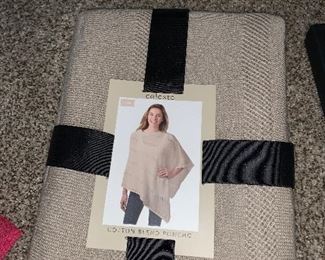 This poncho represents a lovely collection of many New in Packages items that are available for you!