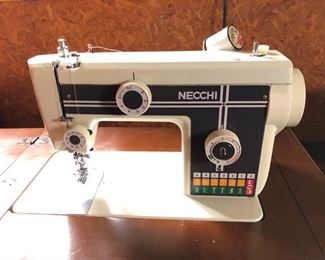 Necchi sewing machine and cabinet with chair......