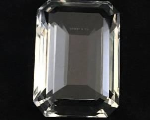 Touch of glamour from Tiffany & Co., this cut crystal paperweight design is the shape of a traditional emerald. No chips. It’s 3″w x 4″d x 2″h. $95