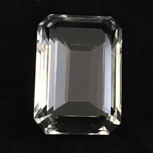 Touch of glamour from Tiffany & Co., this cut crystal paperweight design is the shape of a traditional emerald. No chips. It’s 3″w x 4″d x 2″h. $95