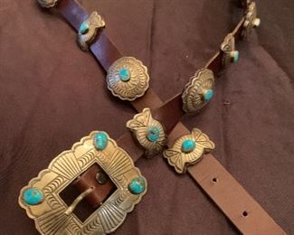 Silver and turquoise Mexican Concho belt. Mounted on 36" brown leather belt with 9 conchos, and 9 smaller pieces with buckle. $600