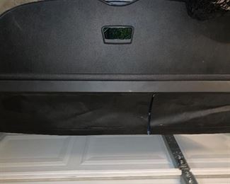Infiniti QX 56 rear hatch divider and cargo nets.