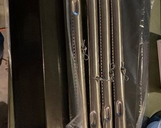 Stainless steel gas grill burners.