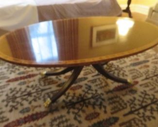 Councill Furniture Oval Mahogany Cocktail Table
Satinwood Banding on Brass Feet
