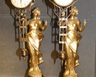 PAIR OF EARLY VICTORIAN FIGURAL SWINGER CLOCKS