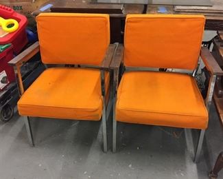 mid mod office chairs with orange upholstery