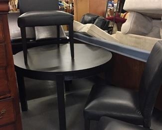 round dining table with leaf and 4 vinyl chairs (sold separately)