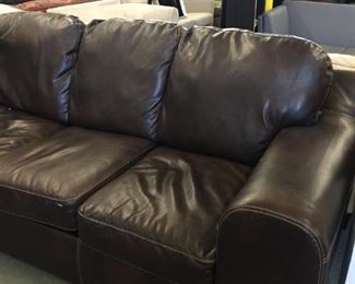dark brown vinyl sofa
