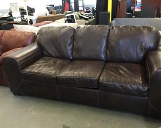 dark brown vinyl sofa