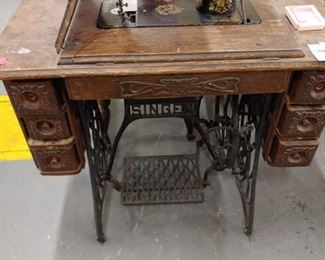 singer sewing machine with machine folded out