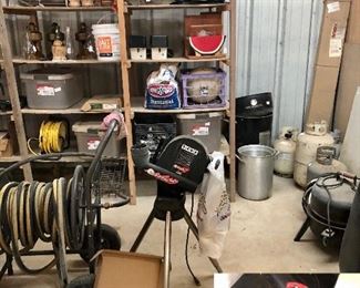 Building full of tools, hoses, propane tanks, ATEC 'Hitting Streak' ball pitcher, balls...