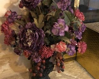 many large floral arrangements- in interesting vases 