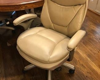 Oval, solid wood kitchen table and four Serta roller chairs (chairs priced separate)