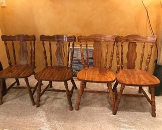 Four solid wood Fiddle Back chairs. Great for kitchen or used as a desk chair
