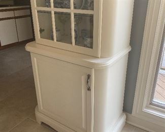 Unique wooden display cabinet with glass; 87.5" L x 31" W x 19" D.  $350