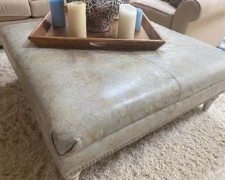 Walter E Smithe Leather ottoman with studs; wooden legs; 43" square; $275  (color is a light grey/green)