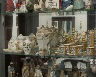 Shelf of fine porcelains.