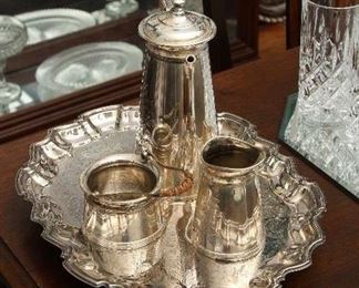 Silver plate service on footed tray.