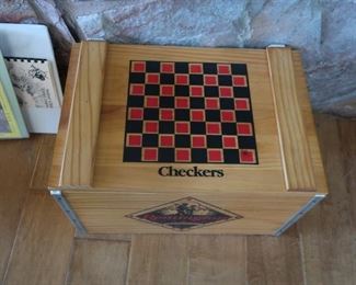 Chess pieces and checkers inside the box