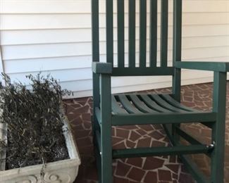 Green outdoor porch rocker, another stone planter