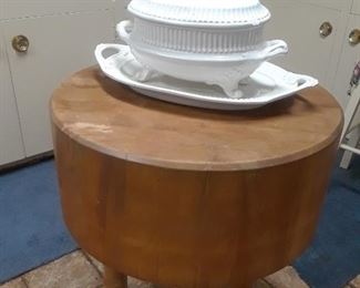 Small scale chopping block on tripod legs. White ceramic tureen and platter from a large selection of dinnerwares.