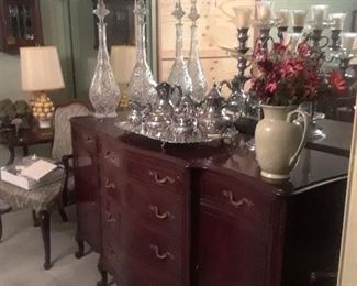 The dining room is traditional, timeless mahogany and in good condition.. Sterling tea service. Very large pair of decanters.