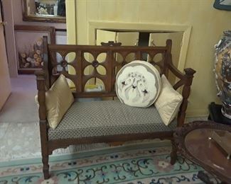 Small scale settee is sturdy and in excellent condition. Needlepoint pillow features a pair of swans.