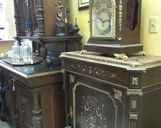 Court cabinet (let) and French Empire style cabines (right) with inlaid mother of pearl.  Clock is dramatic. Working condition.