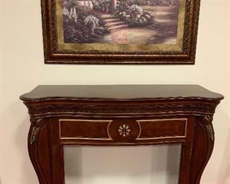 Wooden fireplace frame $100
Painting $80
