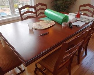 Another kitchen table with 6 chairs and two leafs.