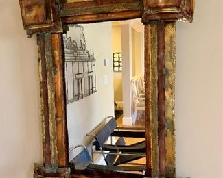 Metal sculptural mirror