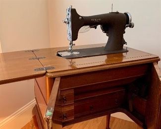 R.H. Macy and Co. Sewing Machine and Table