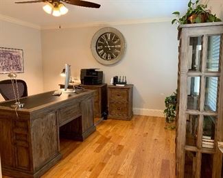 Boston Interiors Hugo Executive Desk Set: Glass/Wood Book Shelf/Display Cabinet, Executive Desk, Two File Cabinets. This set features reclaimed pine and brass hardware. Desk has black leather top.