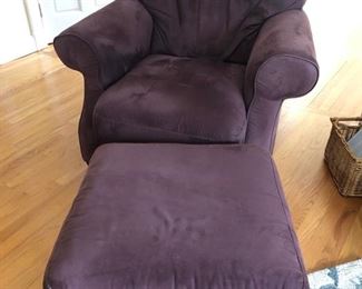 Upholstered armchair with ottoman