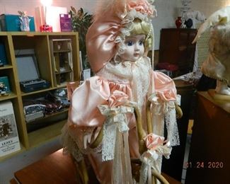 porcelain doll with bike