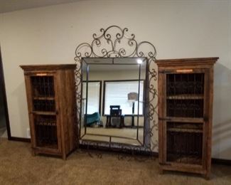 Extremely large mirror. Also 2 cabinets with rod iron doors
