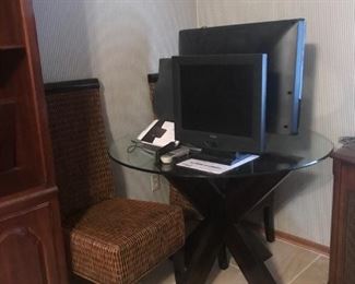 Two tall back modern wicker chairs