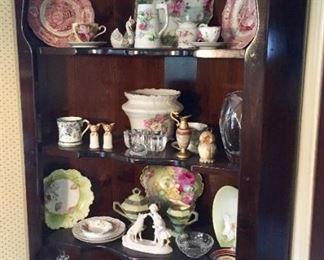 two corner cupboards available.  Beautiful collectible china.