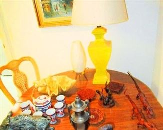 Mid Century Teak Dinning Table With Four Matching Teak Chairs scattered around the house in other rooms. Misc small cast metal  Ram and Boar, mummified alligators, Imari egg cups & oddities