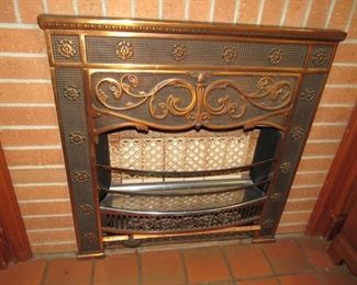 Ornate bronze fireplace heater & surround