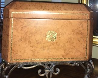 Leather encased decorative box on iron pedestal