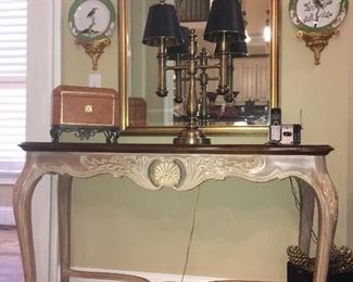 Wellington Hall Sofa table; plates on gilded wall brackets; mirror; lamp; and leather box with iron feet