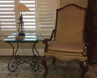 Glass & iron side table; Gentleman's arm chair; monkey lamp