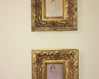 Prints in gilded frames