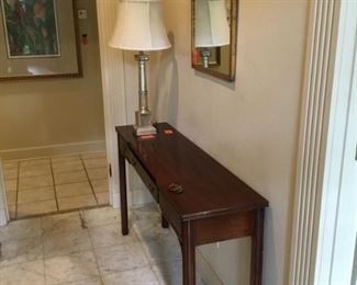 Long Chippendale skinny console with silvered column lamp