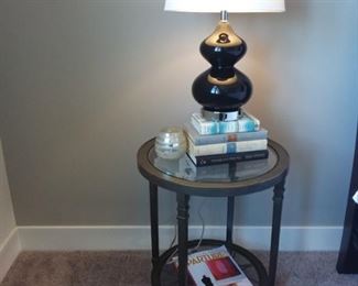 Accent table, books, and lamp