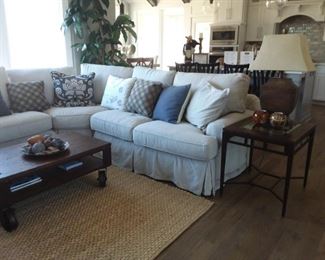Sectional with chaise, end table and lamp, and rustic industrial style coffee table on castors!